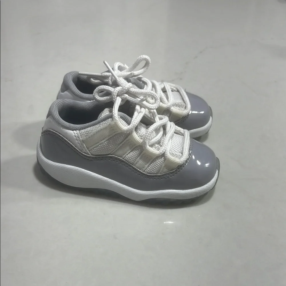 Gray and White Jordan 11 Low Sneakers